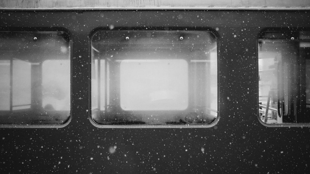 Closeup of train windows on snowy day